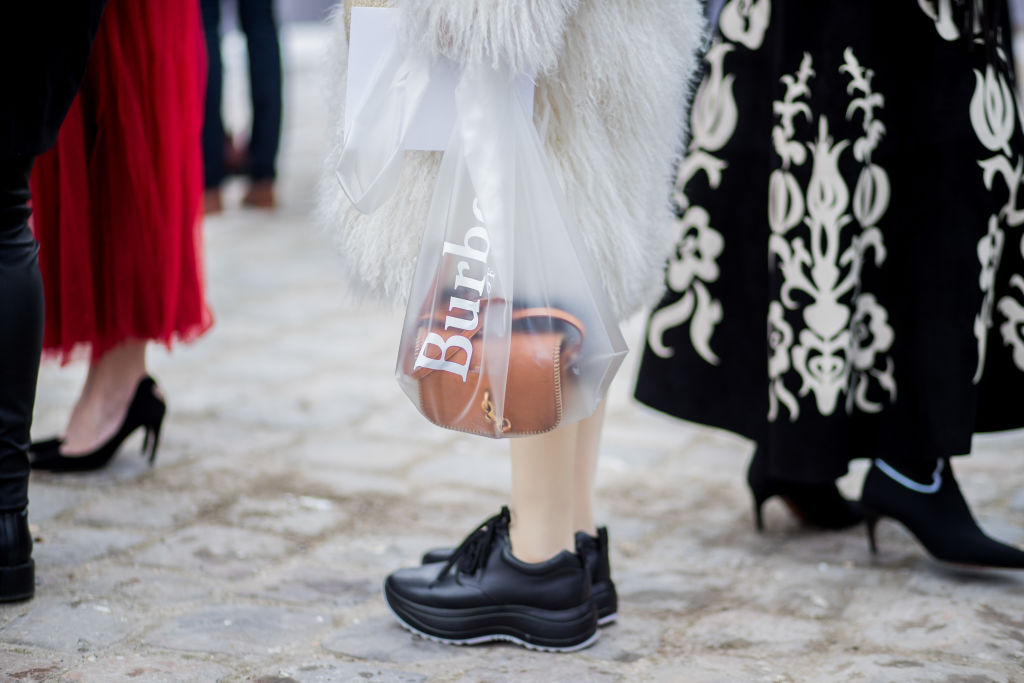 PARIS, FRANCE - FEBRUARY 27: A guest wearing see through transparent Burrberrys bag is seen outside Dior on February 27, 2018 in Paris, France. (Photo by Christian Vierig/Getty Images)