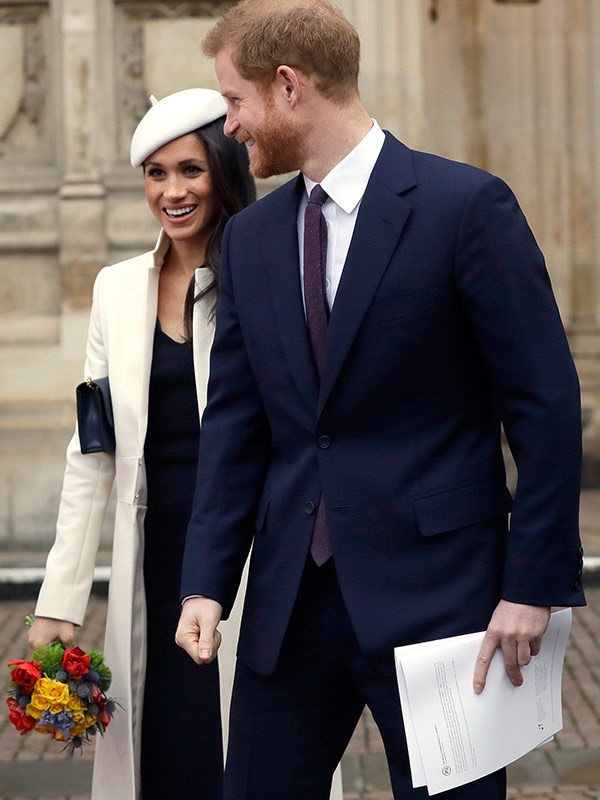 Meghan loves designer goods - including this almost-$2000 Amanda Wakeley coat.