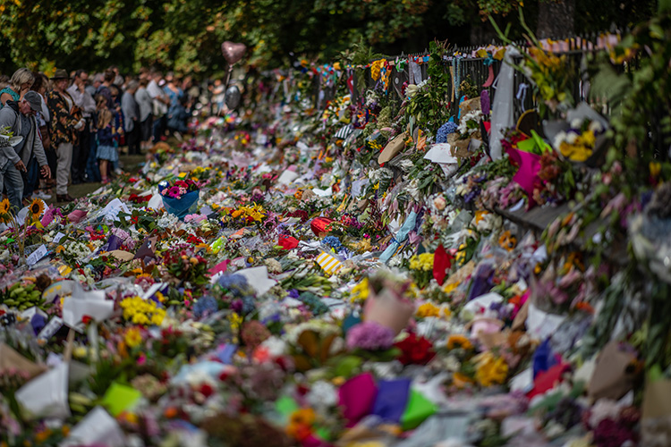 CHRISTCHURCH, NEW ZEALAND - MARCH 19: People view flowers and tributes by the botanical gardens on March 19, 2019 in Christchurch, New Zealand. 50 people were killed, and dozens are still injured in hospital after a gunman opened fire on two Christchurch mosques on Friday, 15 March. The accused attacker, 28-year-old Australian, Brenton Tarrant, has been charged with murder and remanded in custody until April 5. The attack is the worst mass shooting in New Zealand's history. (Photo by Carl Court/Getty Images)