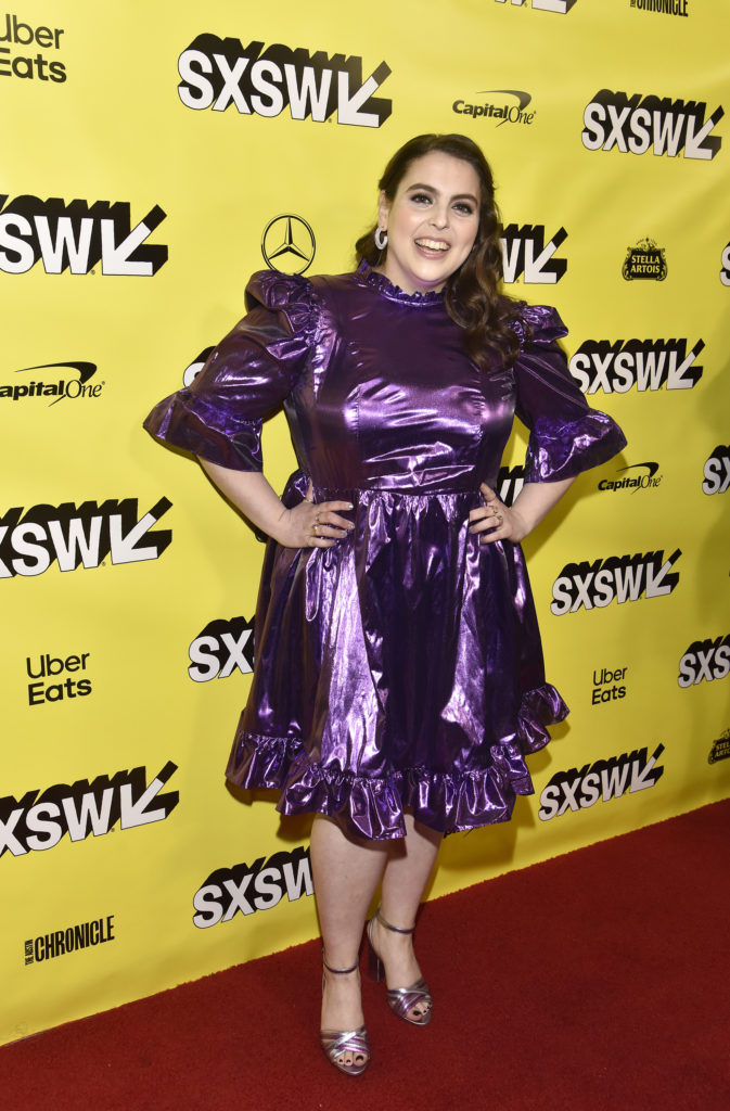 Actress Beanie Feldstein wears a metallic purple dress to the premiere of What We Do In The Shadows during SXSW 