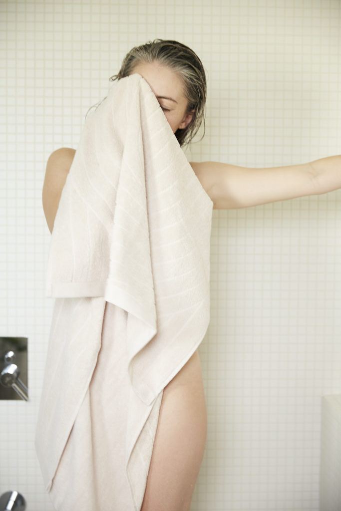 model with baina towel