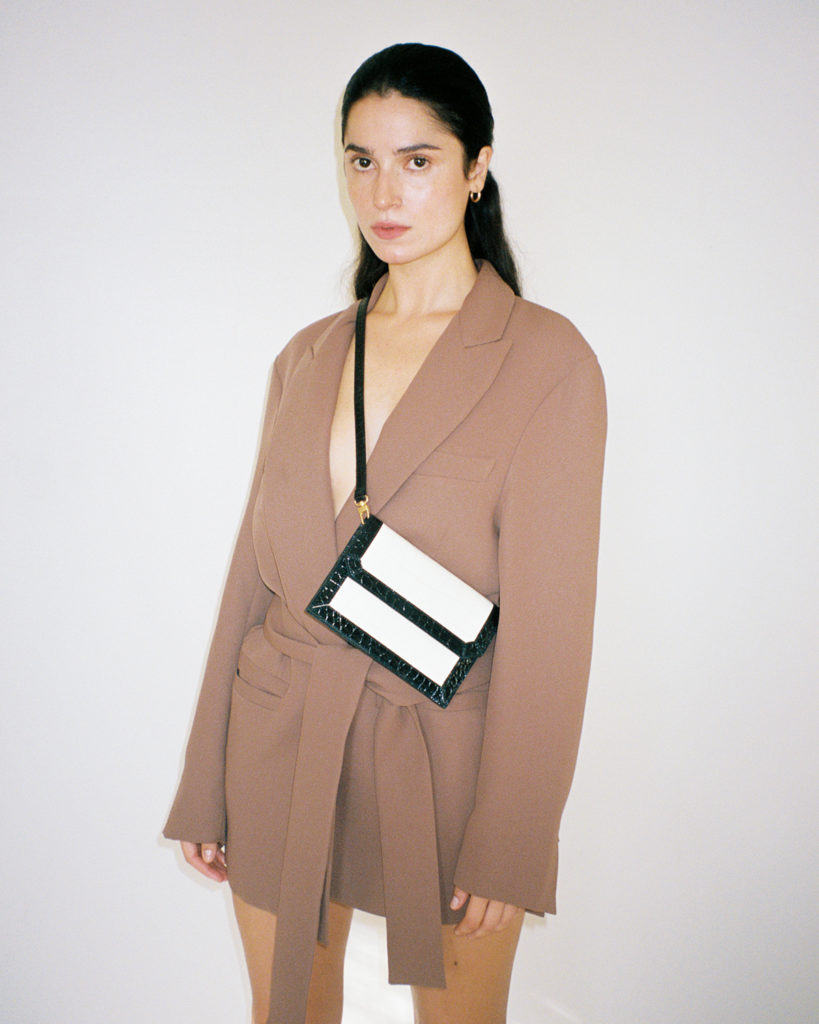 Mini bag by Paris Georgia x By Far, and model in a brown blazer